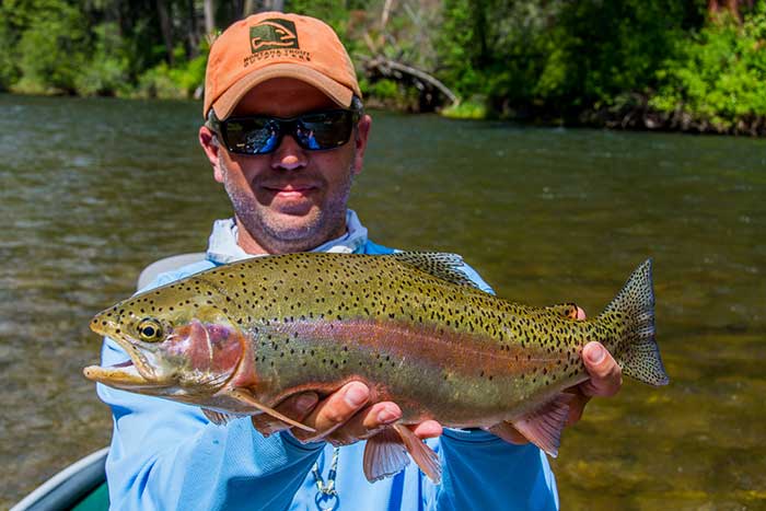 Tony with a dry fly rainbow. 