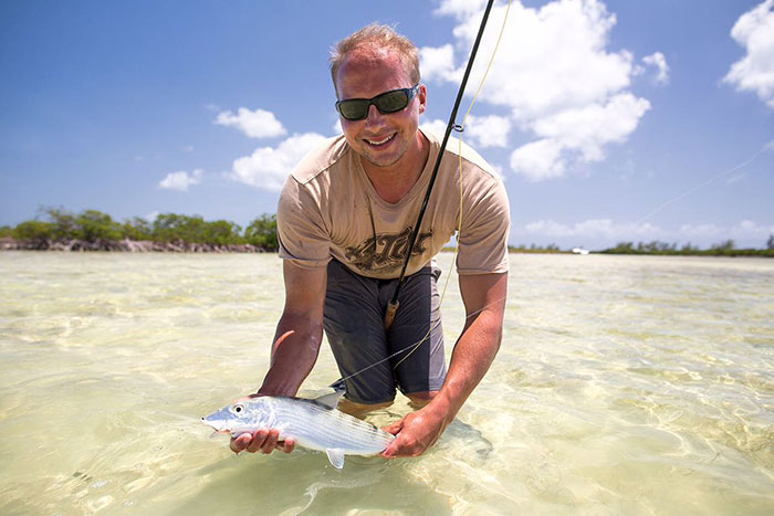 Travis Van Leeuwen with a bonefish caught on a flat in Eleuthera, The Bahamas